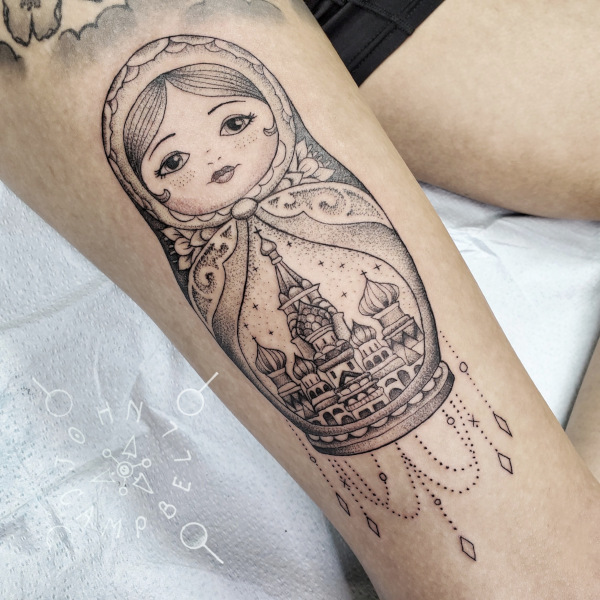 Fine line Russian nesting doll Matryoshka tattoo. Book a custom tattoo with John at Sacred Mandala Studio - Durham, NC.